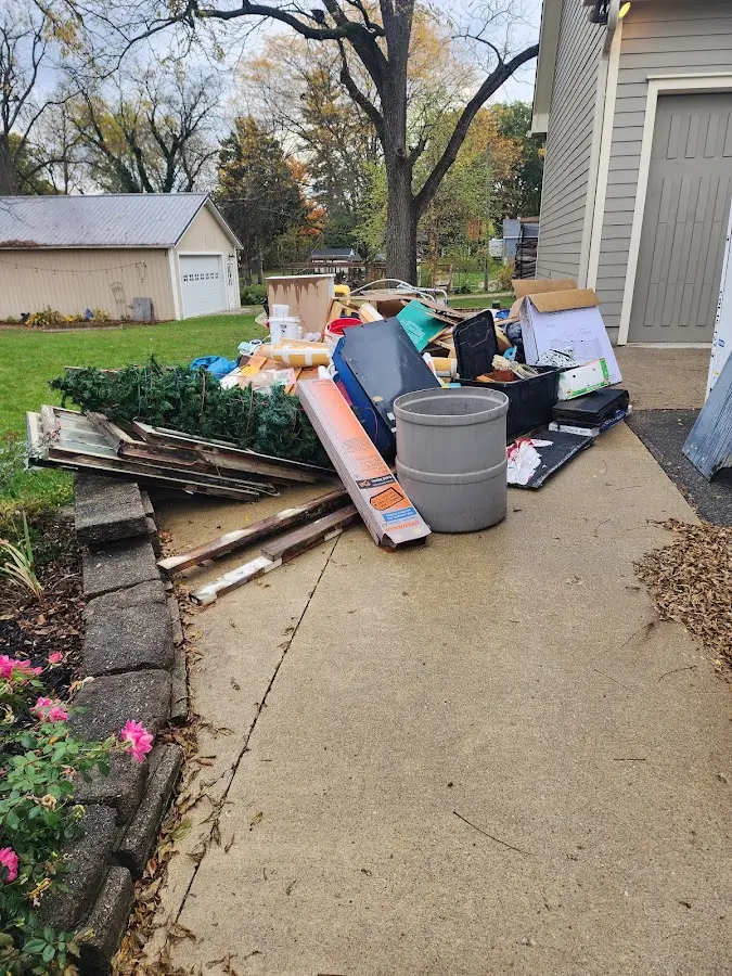 Dumpster being loaded with debris for 10 Yard Dumpster Rental in Meridian